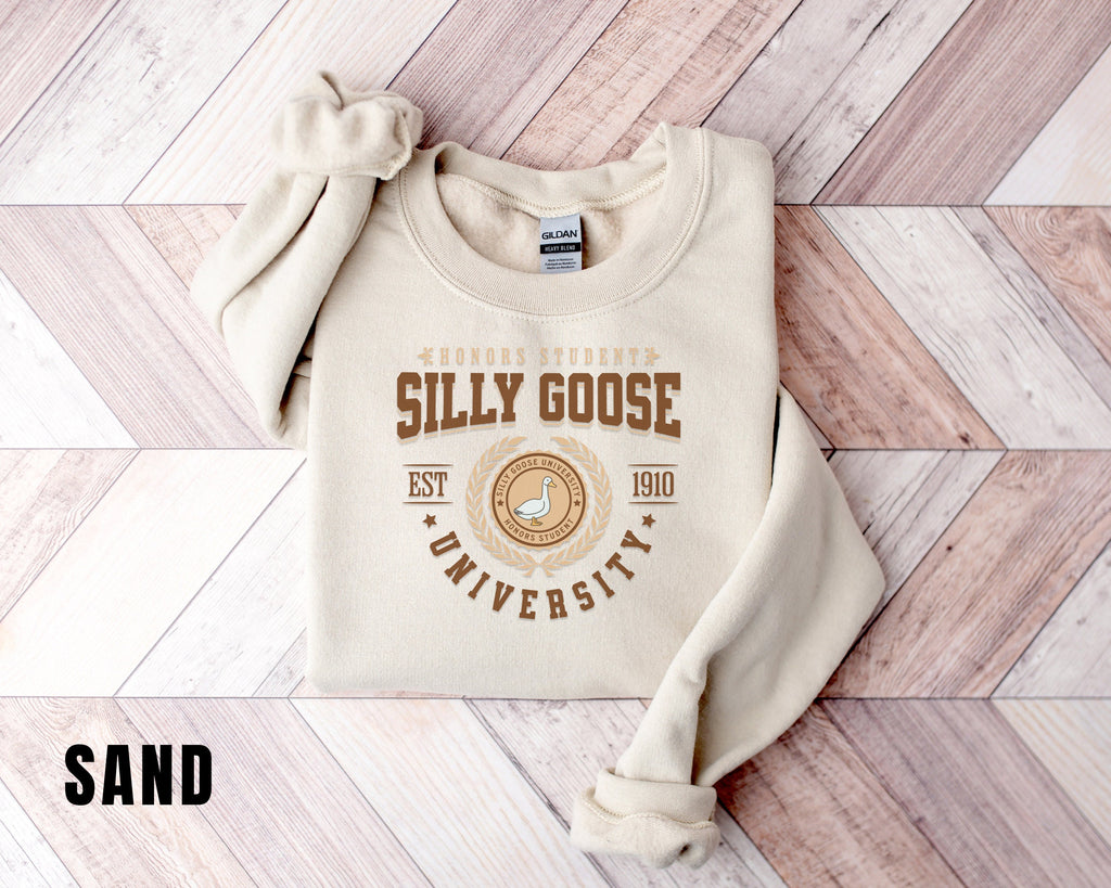 a sweater with a logo on it sitting on a wooden floor