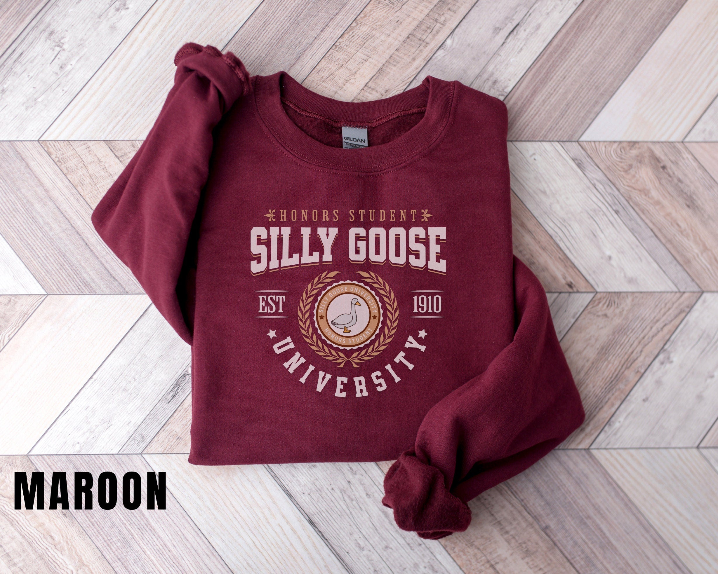 a maroon sweatshirt with the words silly goose on it