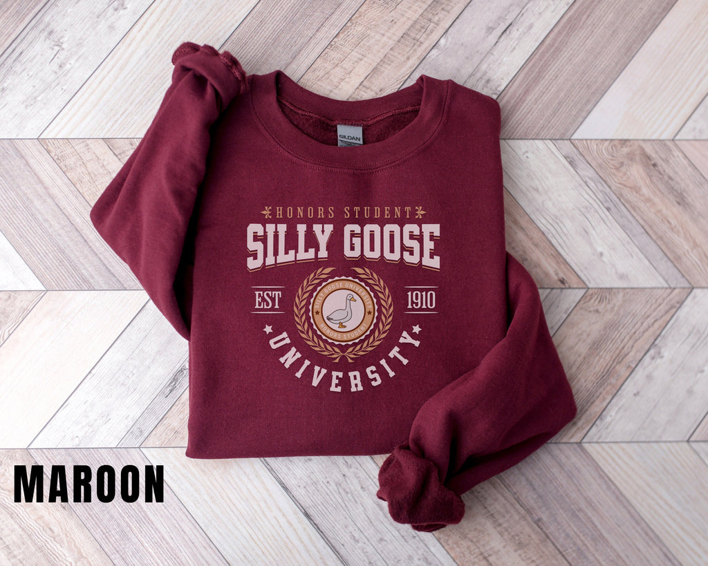 a maroon sweatshirt with the words silly goose on it