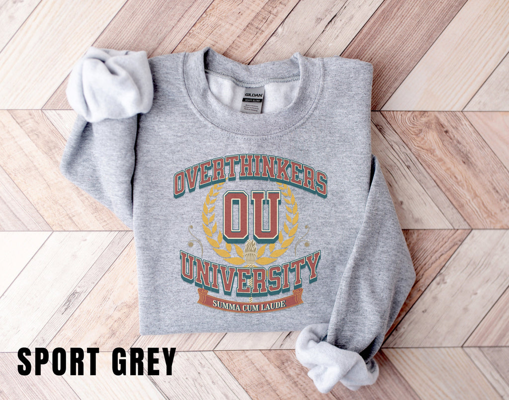 a grey sweatshirt with a university logo on it