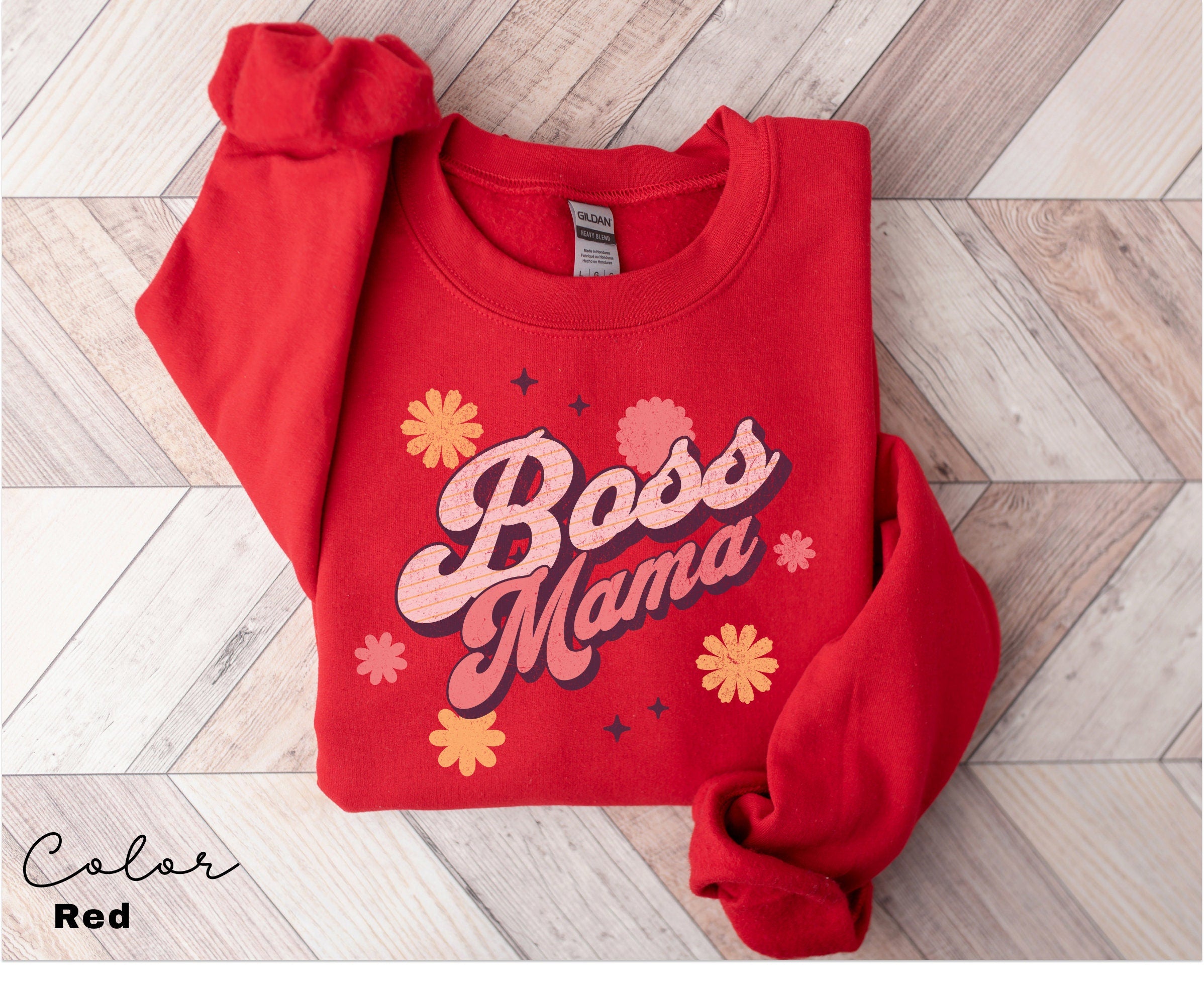 a red sweatshirt with the word boss mama on it