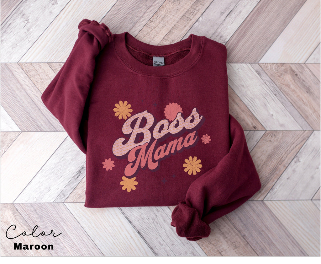 a red sweatshirt with the words boss mama on it