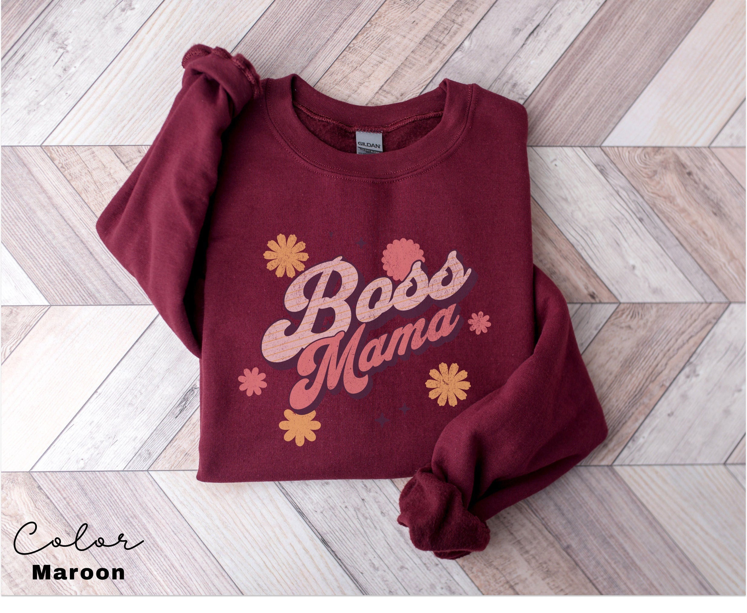 a red sweatshirt with the words boss mama on it