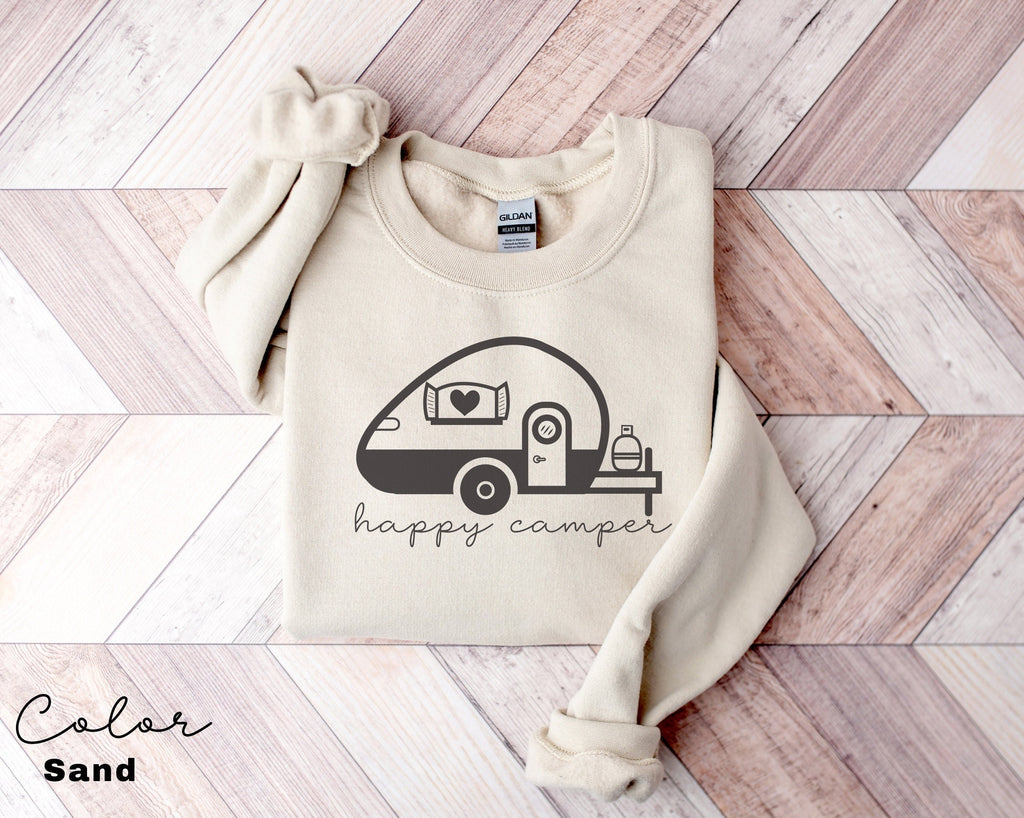 a sweater with the words happy camper printed on it
