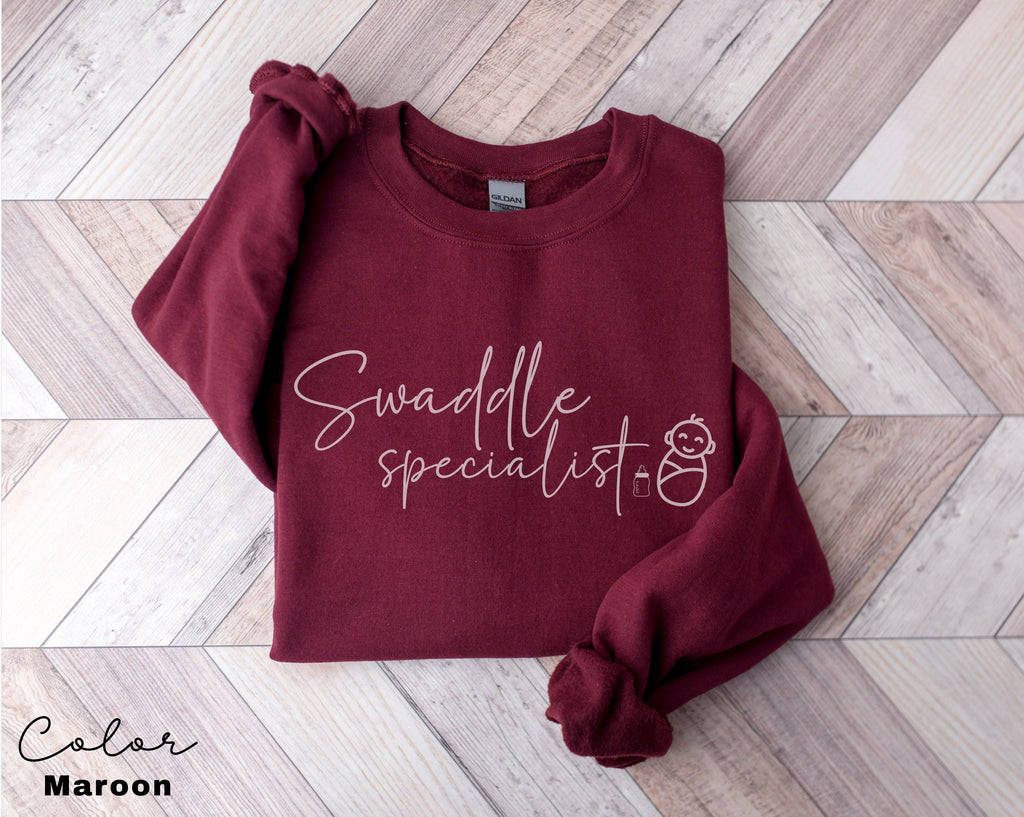 Swaddle Specialist Sweatshirt, Labor And Delivery Crewneck, NICU Nurse Hoodie, Neonatal ICU Registered Nurse, Nurse Pullover, Funny Nurse