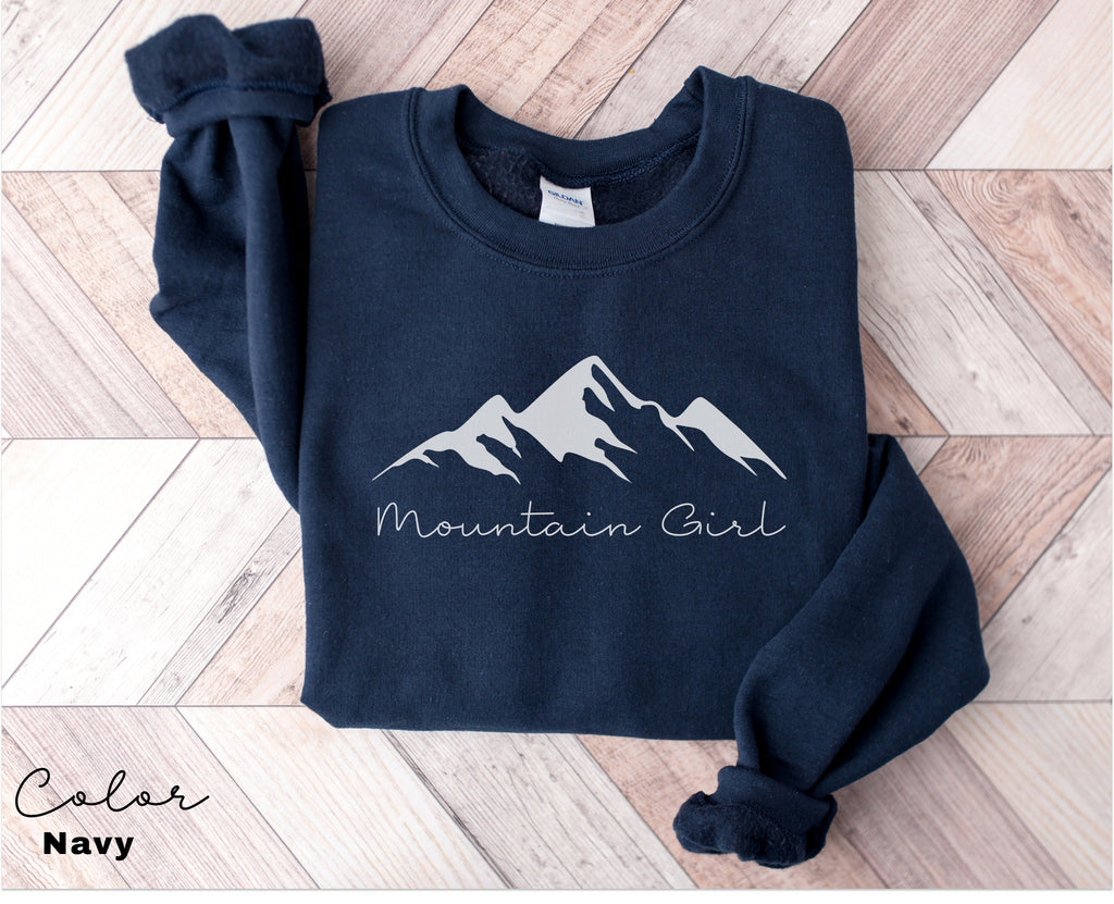 a blue sweatshirt with the words mountain girl on it