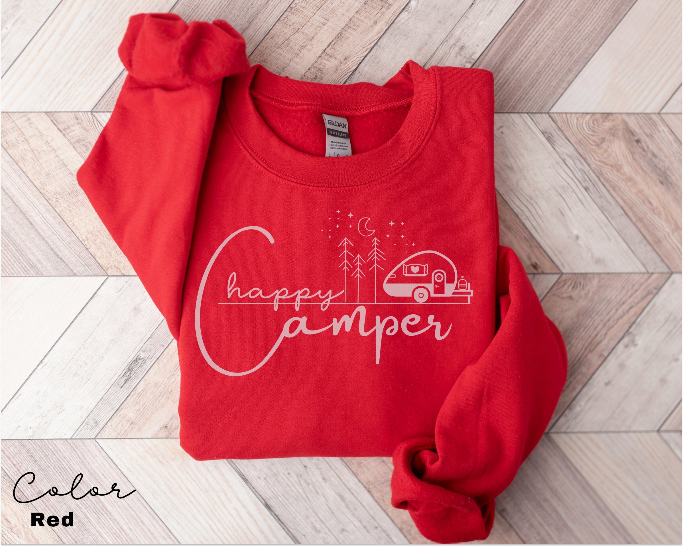 a red shirt that says happy camper on it