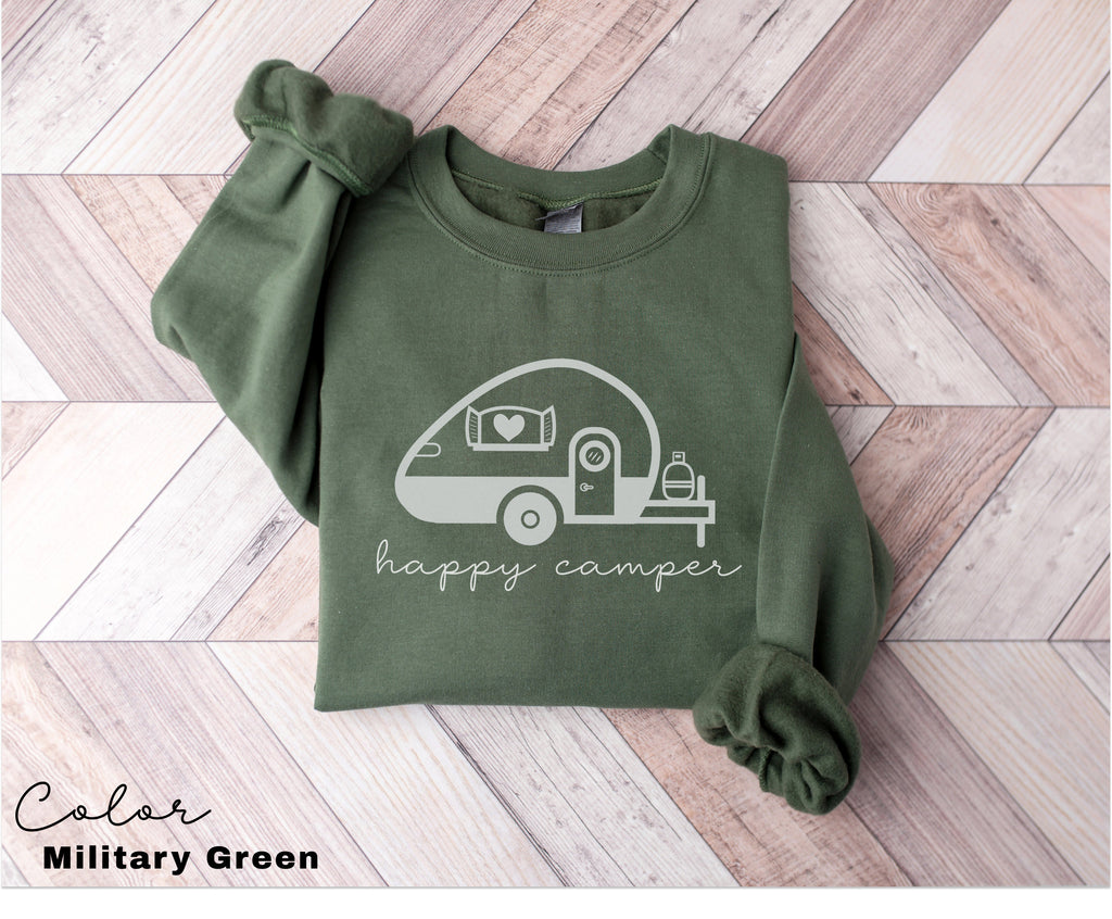a green shirt with a camper drawn on it