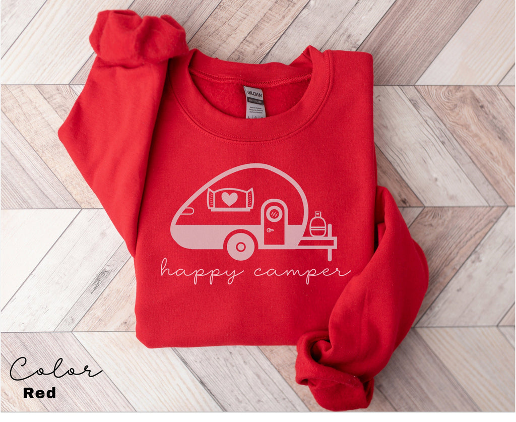 a red shirt with the words happy camper printed on it