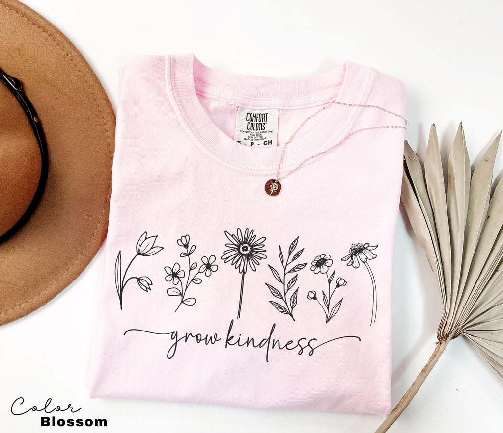 a hat, sunglasses, and a t - shirt with a message on it