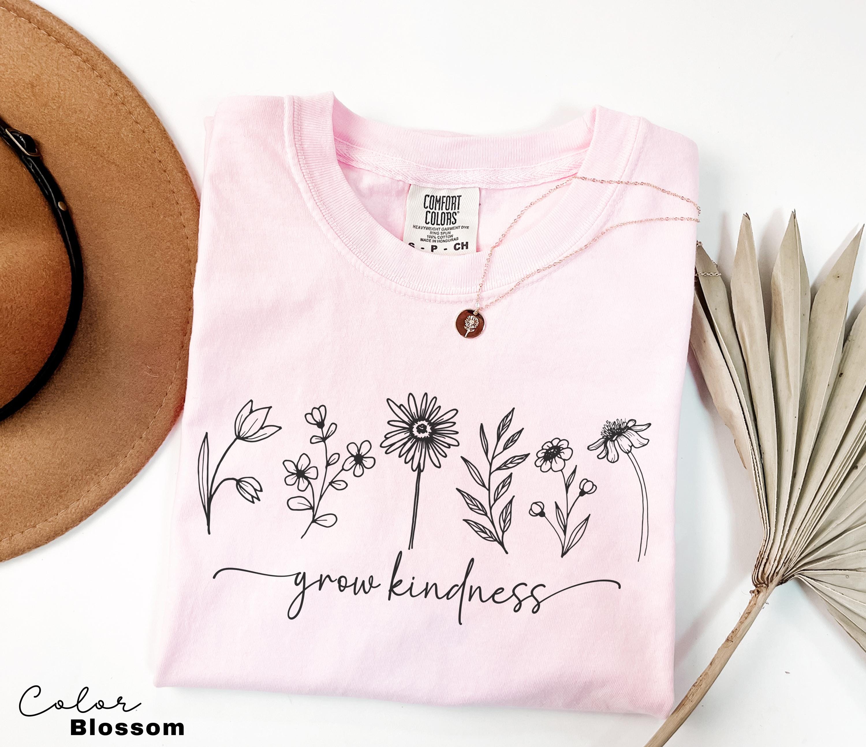 a hat, sunglasses, and a t - shirt with a message on it