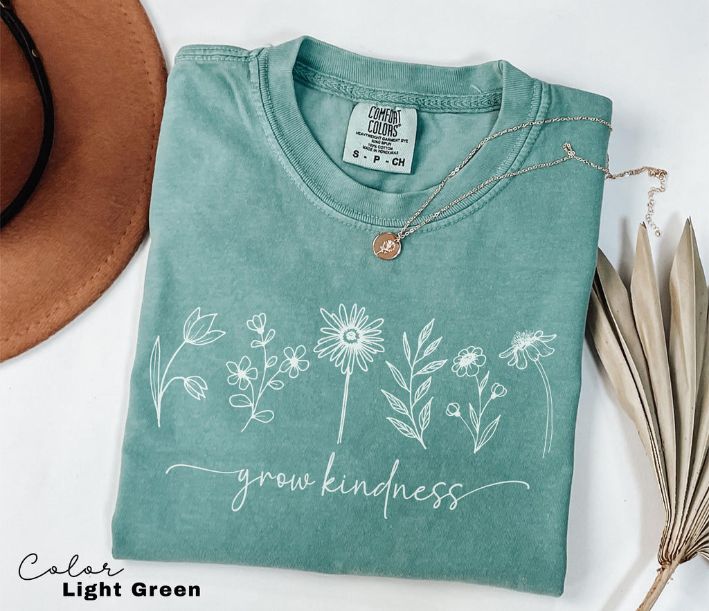 a t - shirt that says grow kindness on it