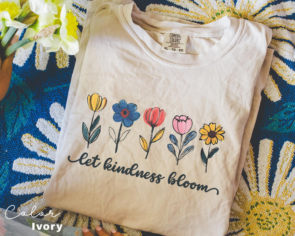 a t - shirt that says let kindness bloom on it