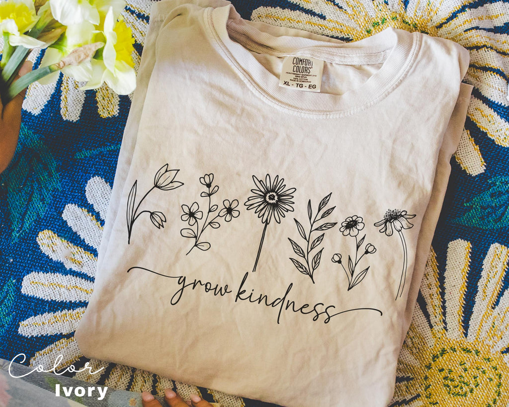 a t - shirt that says grow kindness on it