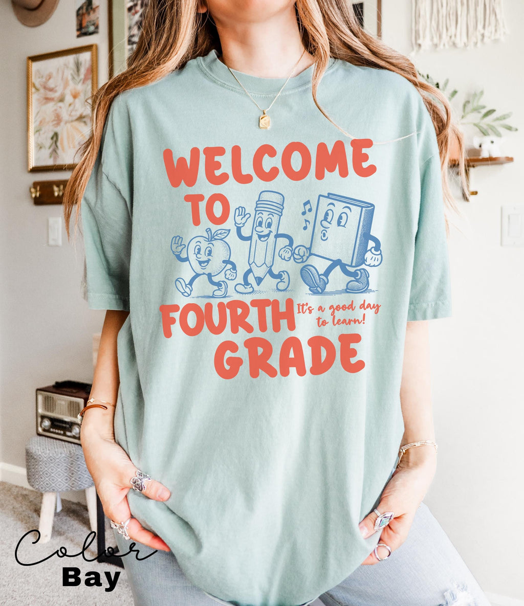 a woman wearing a t - shirt that says, welcome to fourth grade