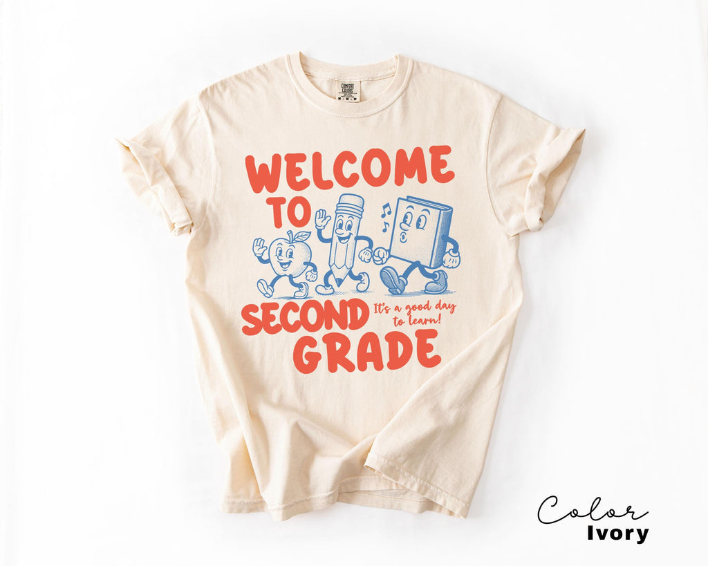 a t - shirt that says welcome to second grade