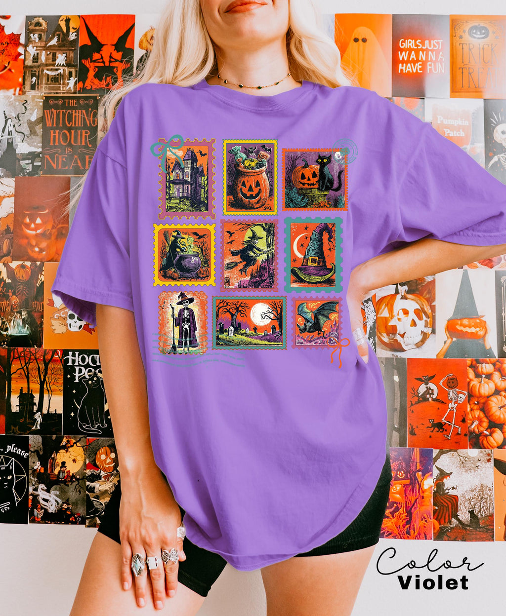 A woman wearing a purple t-shirt with a collage of Halloween-themed illustrations, including pumpkins, bats, skulls, and other spooky and festive images.