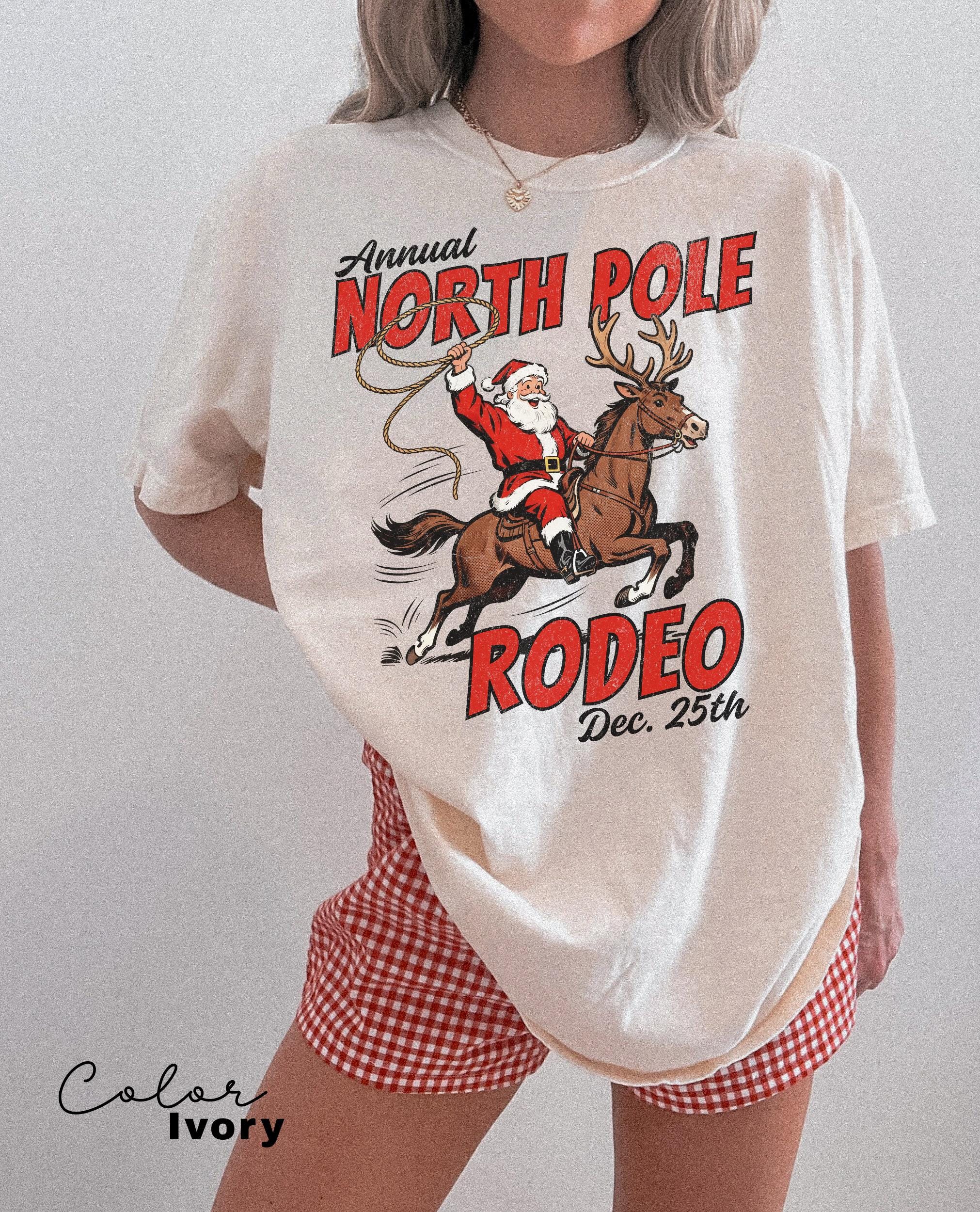 Retro Christmas North Pole Rodeo Shirt, Cowboy Santa Western Roping Christmas Shirt, Howdy Christmas T-shirt, Cowgirl Gift Wrangling Santa