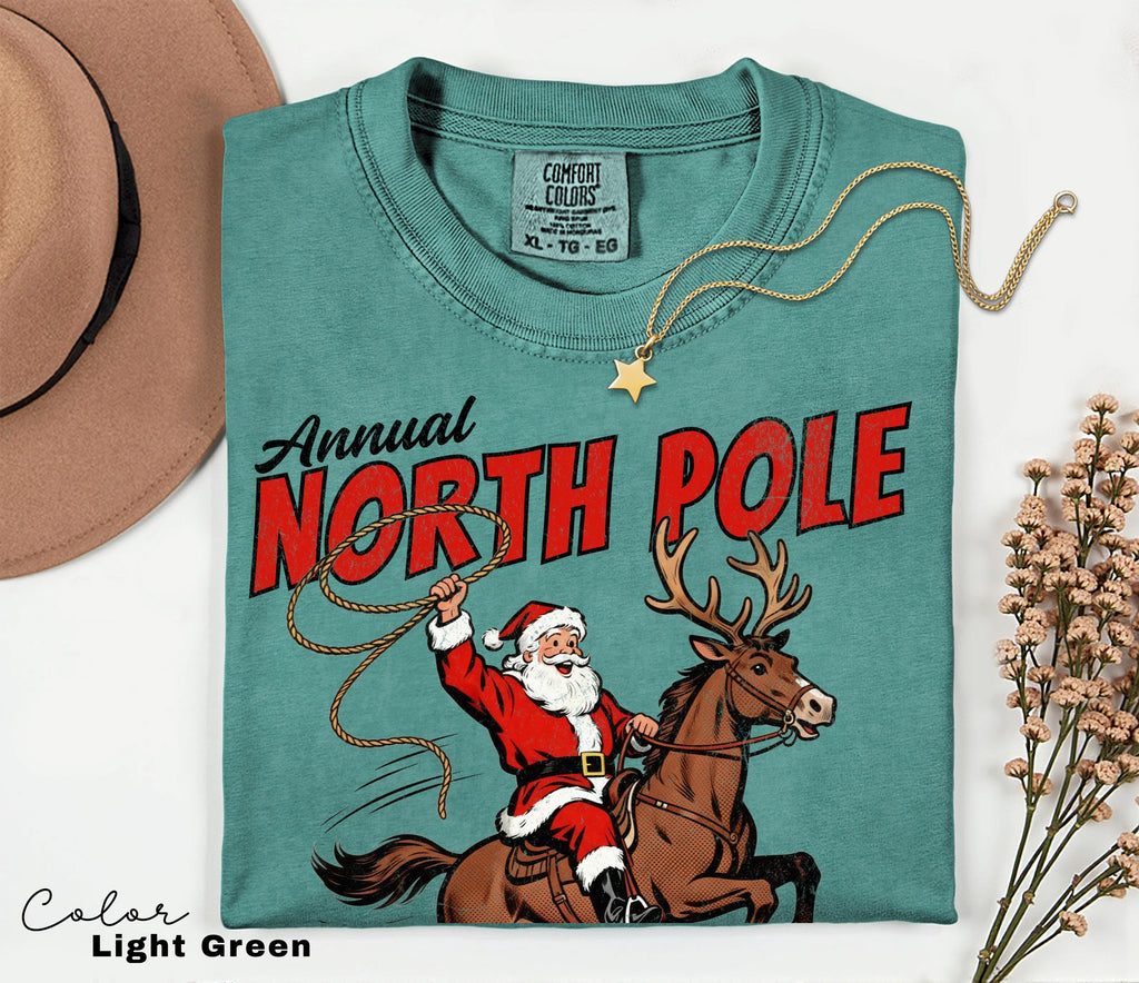 Retro Christmas North Pole Rodeo Shirt, Cowboy Santa Western Roping Christmas Shirt, Howdy Christmas T-shirt, Cowgirl Gift Wrangling Santa