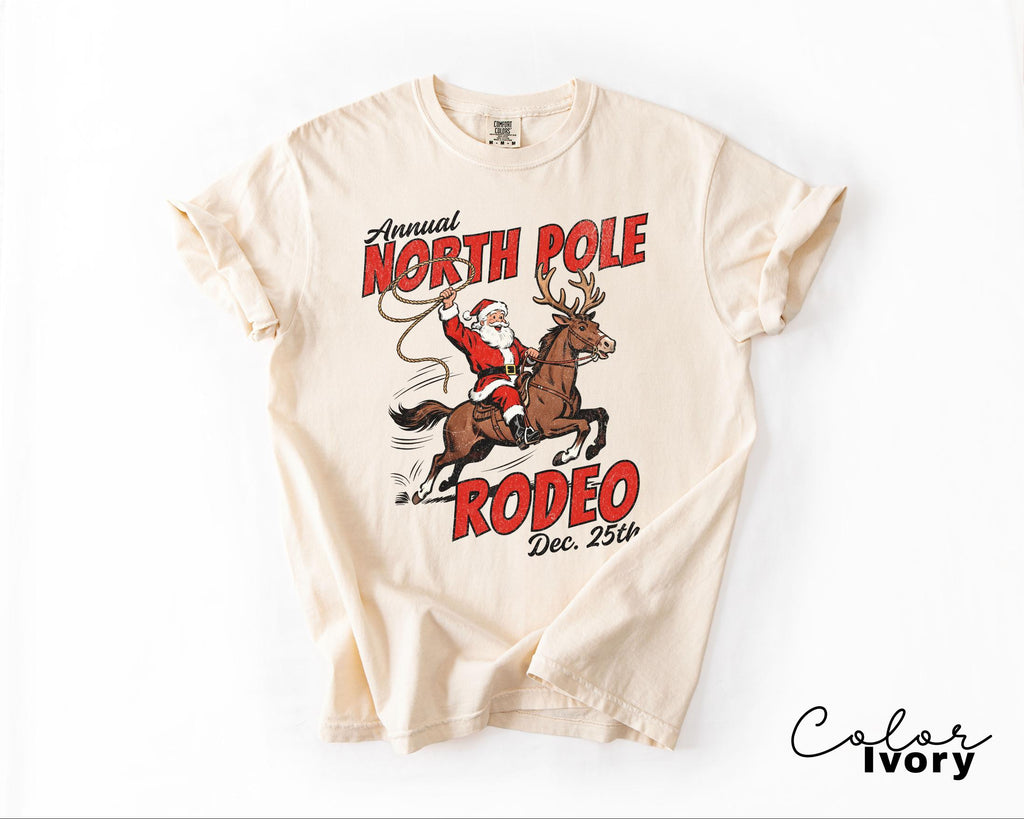 Retro Christmas North Pole Rodeo Shirt, Cowboy Santa Western Roping Christmas Shirt, Howdy Christmas T-shirt, Cowgirl Gift Wrangling Santa