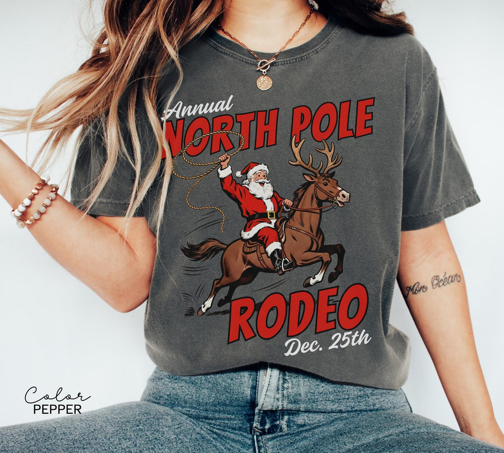 Retro Christmas North Pole Rodeo Shirt, Cowboy Santa Western Roping Christmas Shirt, Howdy Christmas T-shirt, Cowgirl Gift Wrangling Santa